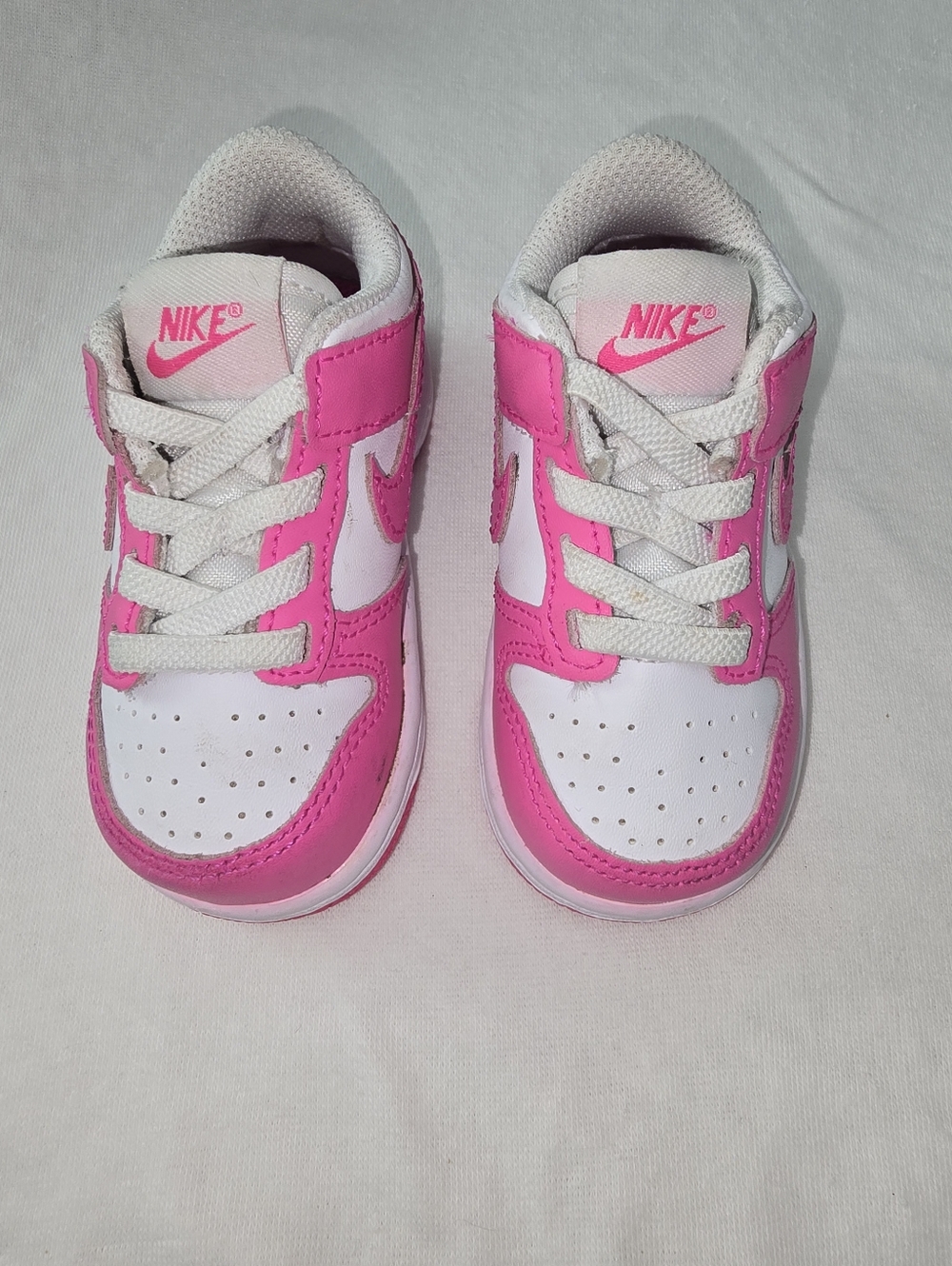 Nike Kids Pink and White Low-Top Sneakers with Swoosh